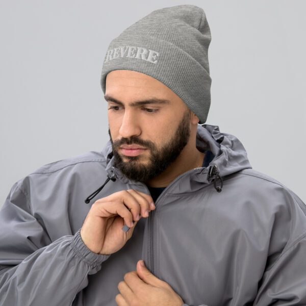 Man wearing Grey beanie with Revere embroidered graphic