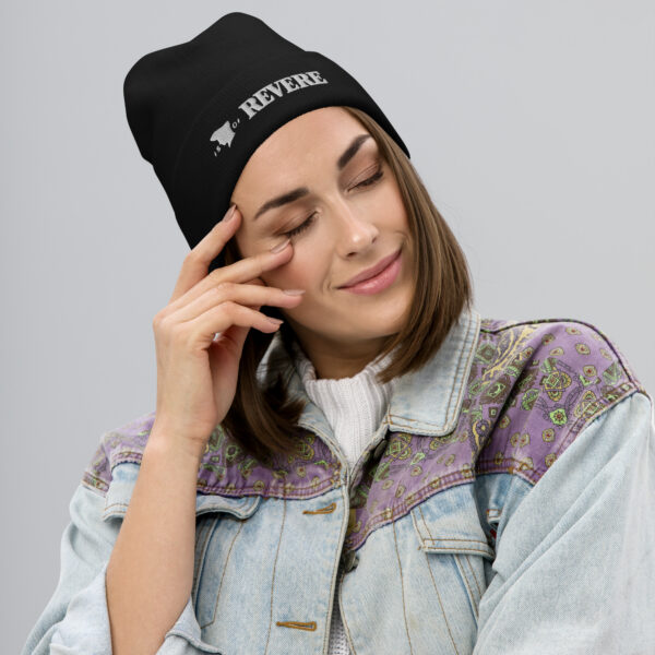 woman wearing black beanie with Revere 1801 embroidered graphic