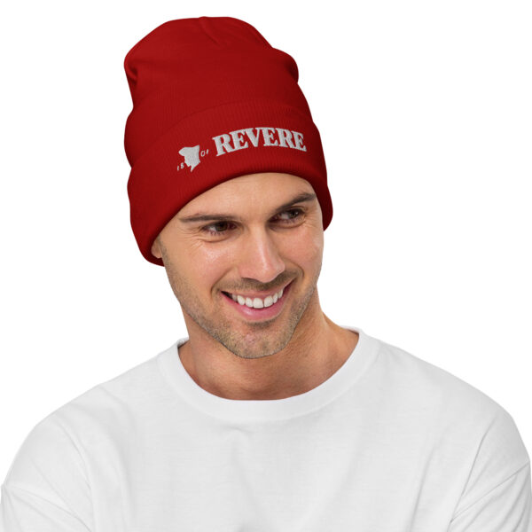 man wearing red beanie with Revere 1801 embroidered graphic