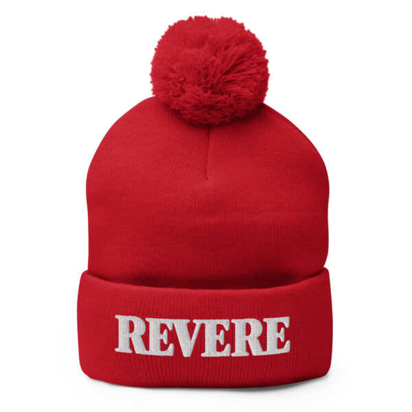Red pom pom hat with Revere embroidered graphic