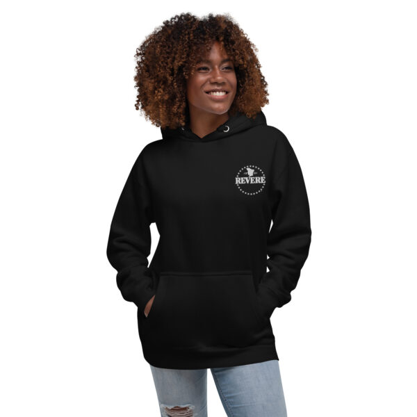 Woman wearing black hoodie with white Revere logo