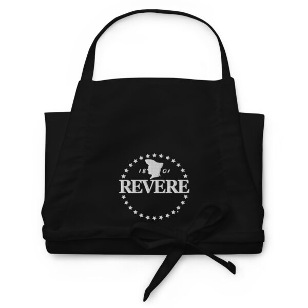 black apron folded with White Revere logo
