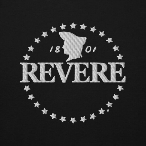 close up of white embroidered revere logo on black hoodie